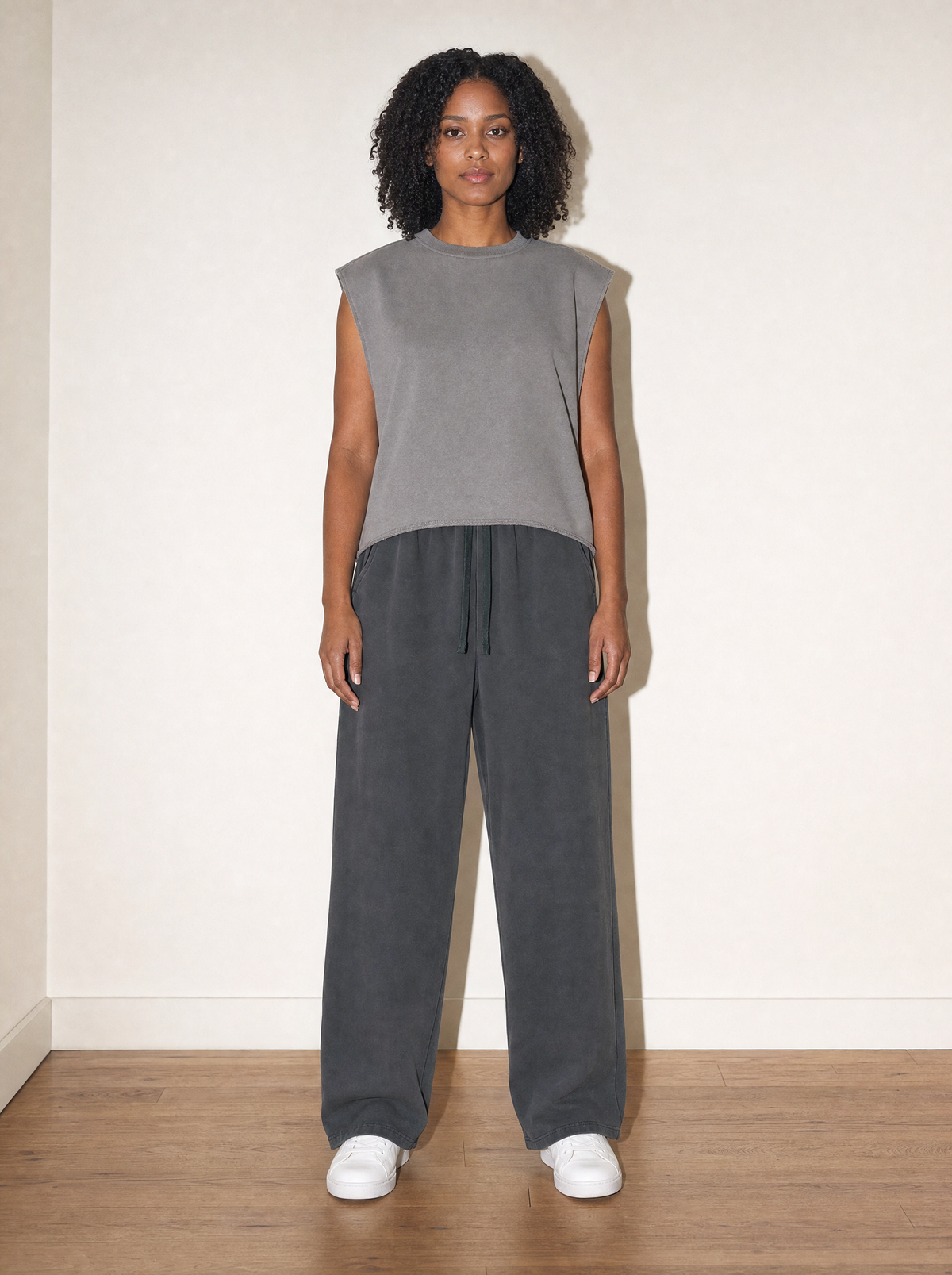 Home & Away Terry Tank in Gray, front view, worn against the apartment wall: 340 gsm French terry with a squared-off hem